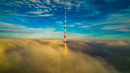 Obraz premium Aerial view of the television tower in the fog