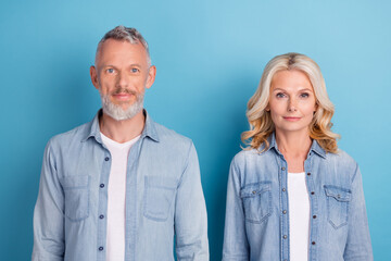 Photo of mature couple happy positive smile spouses confident wear denim isolated over blue color background