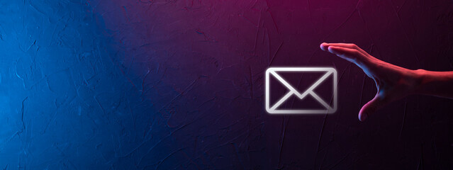 Businessman hand holding e-mail icon, Contact us by newsletter email and protect your personal...