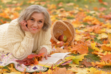 Portrait of senior woman resting in park