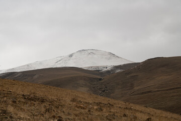 Panoramic  view on the snow covered mountains and hills.