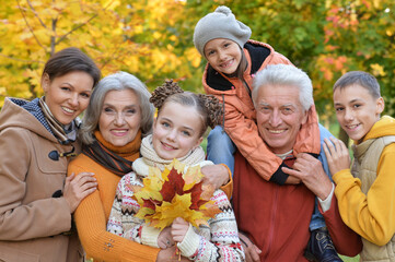 Fototapeta premium Portrait of happy family resting in park