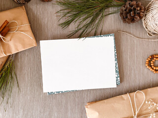 Christmas decorations and empty vintage paper on table, background, mockup