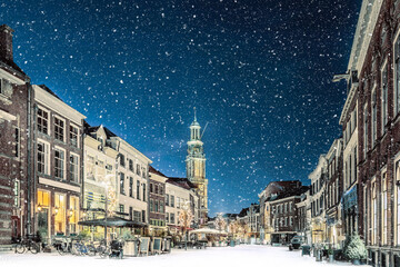 Bars and restaurants in wintertime with christmas lights on the Houtmarkt square in Zutphen