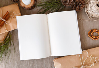 Christmas decorations and empty vintage notebook on table, background, mockup