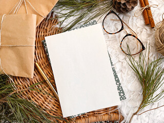 Christmas decorations and empty vintage paper on table, background, mockup