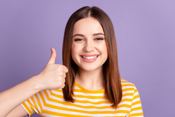 Photo of young cheerful girl show thumb-up advertisement approve isolated over violet color background