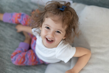 Cute little girl smiling at home