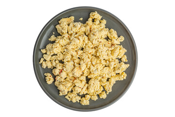 Scrambled eggs, omelet. Texture of omelet on a gray plate, white background, top view