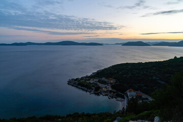 sunset on the Adriatic Highway in Croatia with a view of the coast and silhouettes of islands in the distance