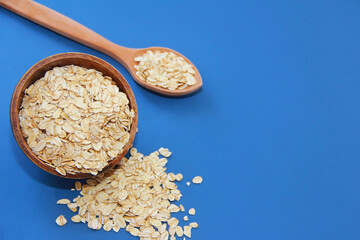 dry oat flakes in a plate for dietary nutrition
