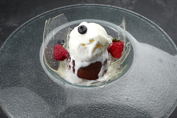 Dessert chocolate fondant with ice cream and strawberries