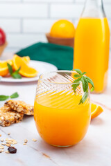 natural orange juice with fruits and nuts and cereals for a healthy breakfast or snack