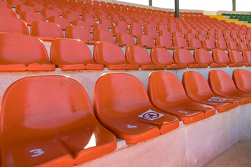 Naklejka premium Empty stadium seats, because of covid pandemic lockdown.