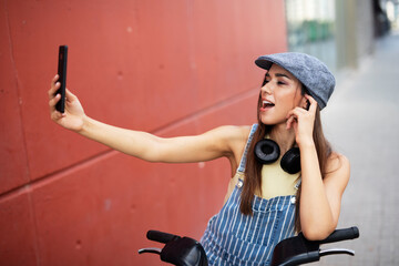 Beautiful woman getting ready for a ride. Beautiful happy lady with electric bicycle