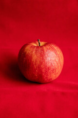 close up fresh red apple on red background