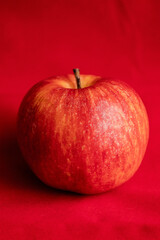 close up fresh red apple on red background