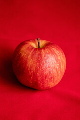 close up fresh red apple on red background
