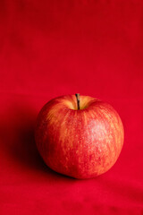 close up fresh red apple on red background