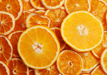 Fresh orange cut in half on dried orange slices background