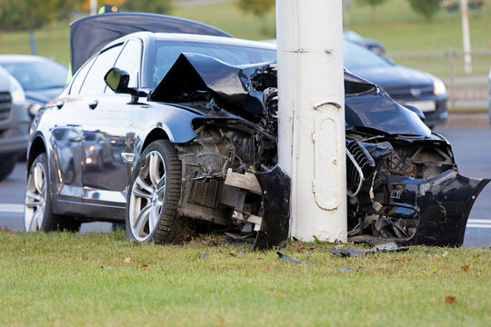 Car Accident. Traffic Collision. Car Crashes into Light Pole