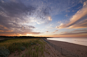 Beach boardwalk, fiery orange and blue sunset beautiful skies