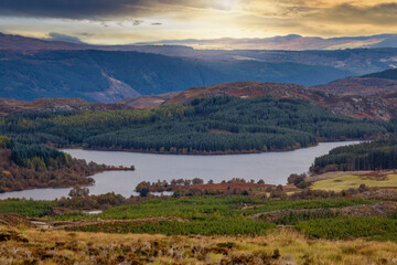 Fototapeta na wymiar Panoramic view from the Suidhe viewpoint over the hills to Loch Tarff at the Scottish highlands during autumn time