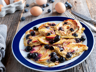 Healthy breakfast plate with oatmeal pancakes, apples and blueberries