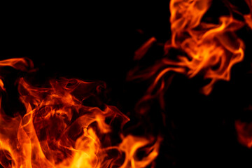 Abstract flame, fire flame texture, background. Blurred moving tongues of fire on a dark background.