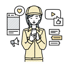 立ってスマートフォンでさまざまなSNSで楽しく交流する作業員の女性