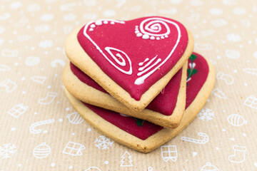 Heart shaped gingerbread cookies on brown background