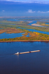 River with ship in autumn, air photo