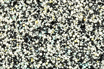 Background made from a macro photo of the inside of the filter with active carbon and water...