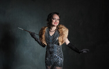 Portrait of beautiful elegant woman in retro 20 – 30 style with veil