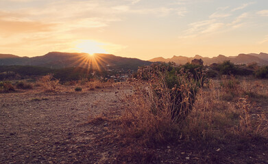 Walk through the mountains at sunset