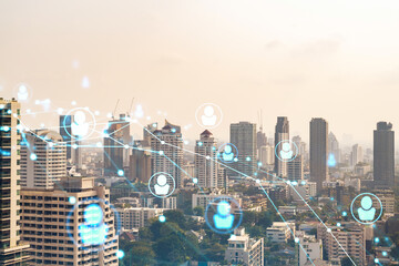 Obraz premium Social media icons hologram over panorama city view of Bangkok, Southeast Asia. The concept of people networking, connections and career opportunities. Double exposure.