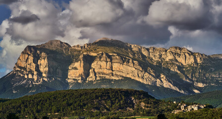 Sunset in an impressive mountain with a town at its feet