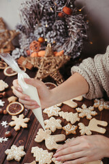 Christmas food. Decorating gingerbread cookies