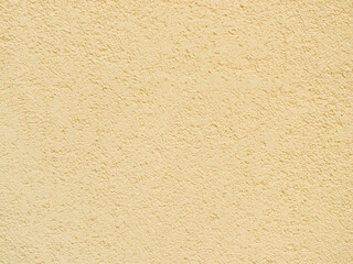 Yellow cement wall close up. Textured background
