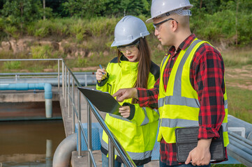 Environmental engineers work at wastewater treatment plants,Water supply engineering working at...