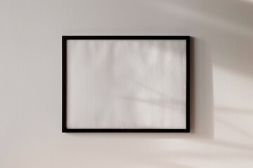 Obraz premium Black photo frame mockup 4x3 on white wall