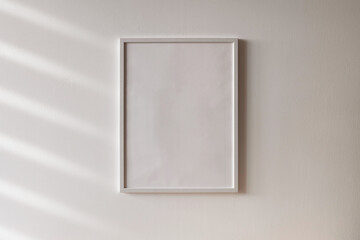 White wooden photo frame mockup on white wall 