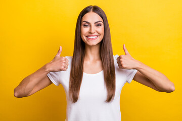 Photo portrait girl brown hair showing thumb-up gesture isolated vivid yellow color background