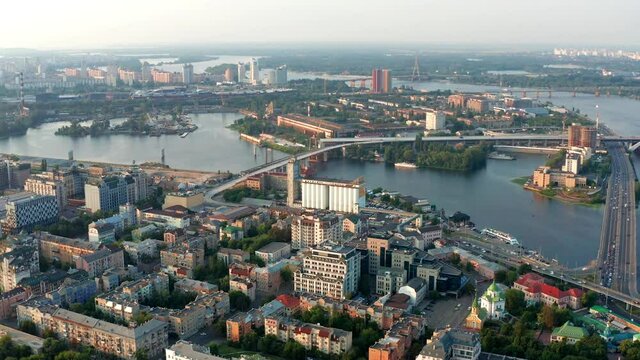 Top view of Podol. Many buildings and churches. Evening view of the river Dnipro.