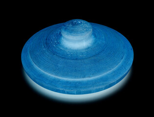 Round blue wooden carved lid isolated on black background