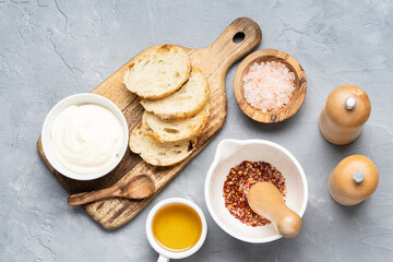 Fried toast made of fresh bread with sauce and olive oil. Alternative handmade food cooking concept. Top view, copy space