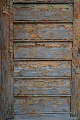 Background and texture of old wooden boards with remnants of paint.