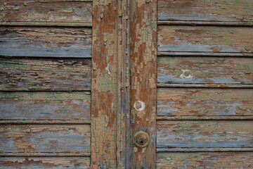 Background and texture of old wooden boards with remnants of paint.