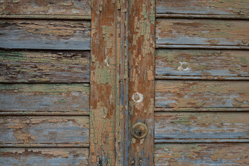 Background and texture of old wooden boards with remnants of paint.