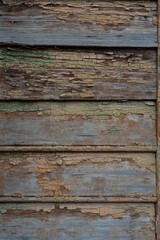 Background and texture of old wooden boards with remnants of paint.